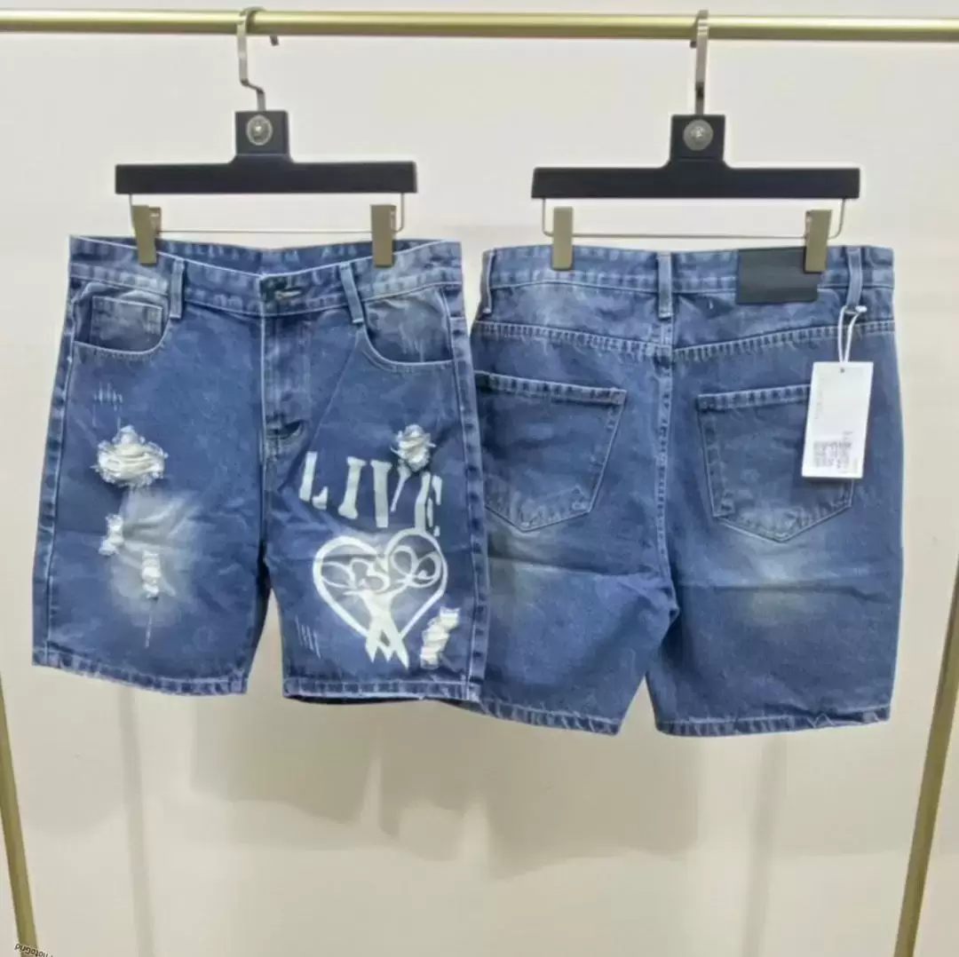 Distressed Denim Shorts with a White Graphic Print.